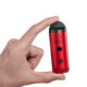 Cipher Herby Dry Herb Vaporizer in carmine red being held between two fingers to show size