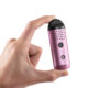 Cipher Herby Dry Herb Vaporizer in tickled pink being held between two fingers to show size
